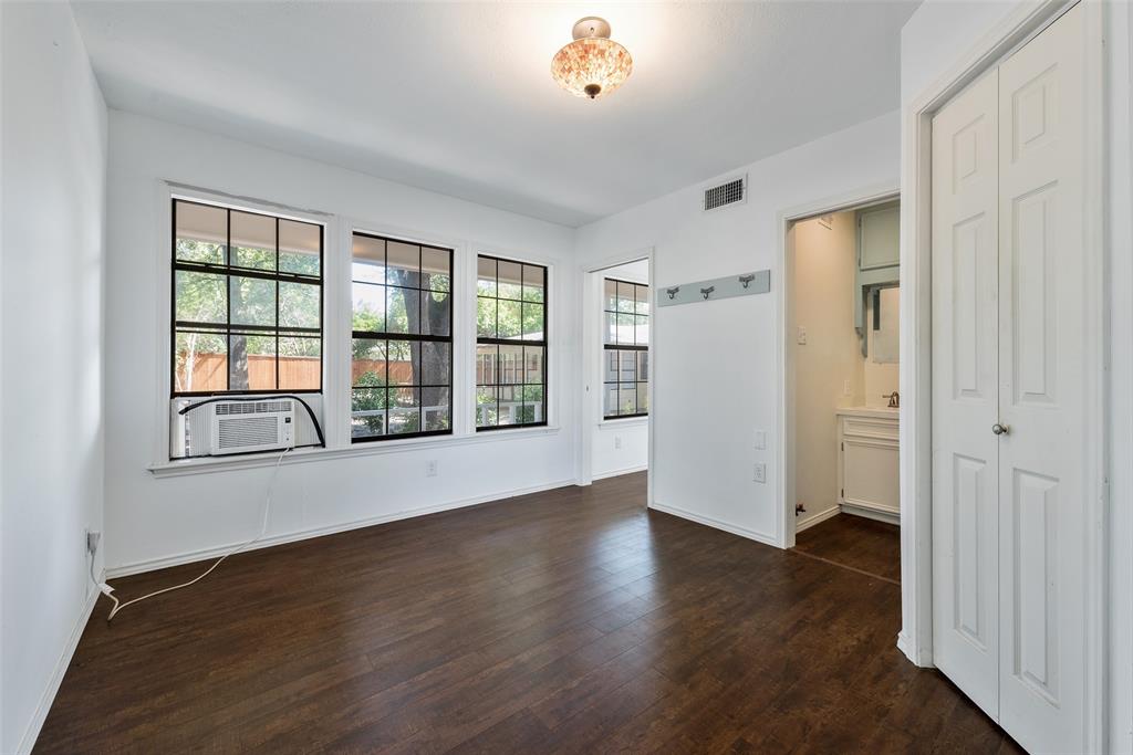 616 Laurel Road, Unit A Athens, TX 75751 - Photo 23 of 24 an empty room with wooden floor and windows