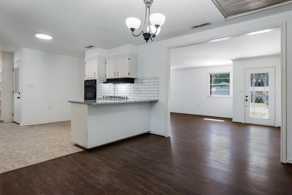 616 Laurel Road, Unit A Athens, TX 75751 - Photo 5 of 24 a view of kitchen with granite countertop cabinets and wooden floor