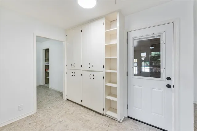 a large kitchen with granite countertop a sink and dishwasher stove top oven