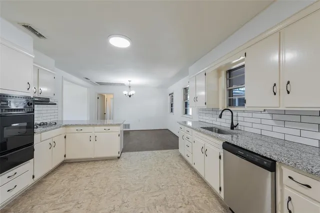a view of storage and utility room with closet