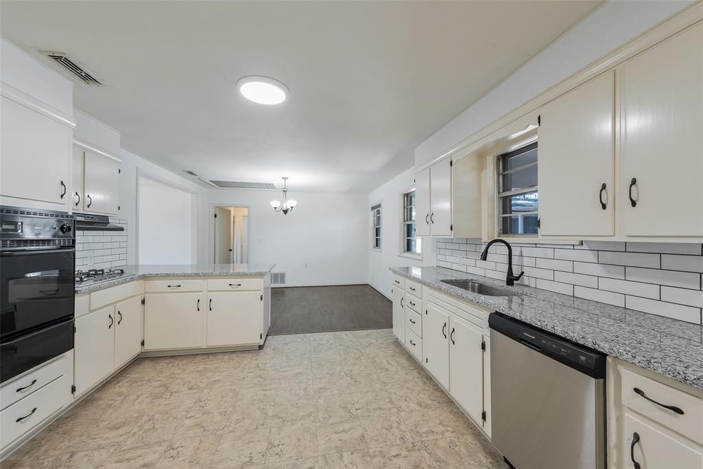 616 Laurel Road, Unit A Athens, TX 75751 - Photo 9 of 24 a large kitchen with granite countertop a sink and dishwasher stove top oven