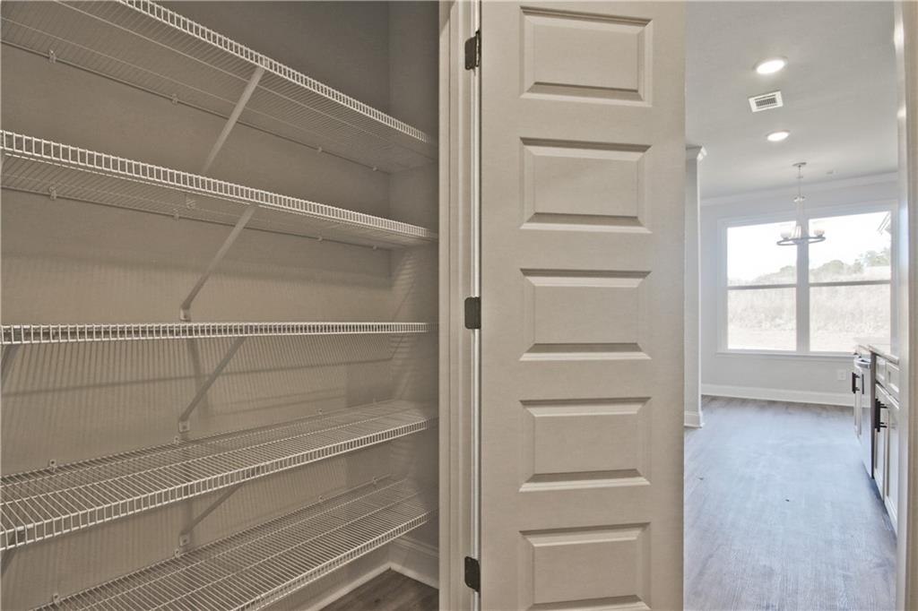 5984 Spring Way Lithonia, GA 30058 - Photo 18 of 37 a view of walk in closet with empty racks