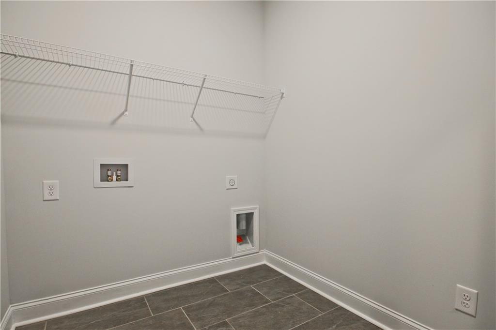5984 Spring Way Lithonia, GA 30058 - Photo 19 of 37 a view of a room with racks on the wall
