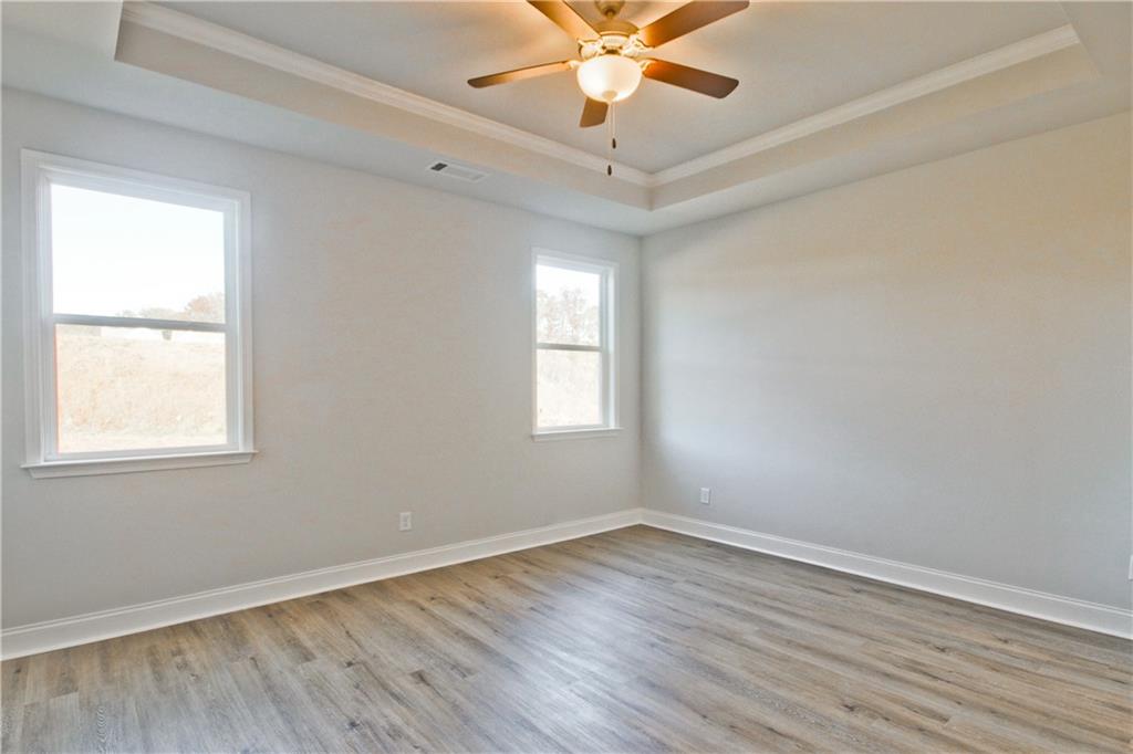 5984 Spring Way Lithonia, GA 30058 - Photo 20 of 37 a view of an empty room with wooden floor and a window
