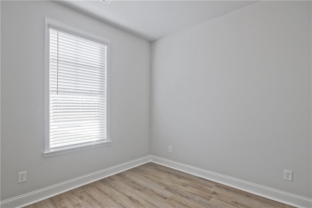 5984 Spring Way Lithonia, GA 30058 - Photo 30 of 37 an empty room with a window