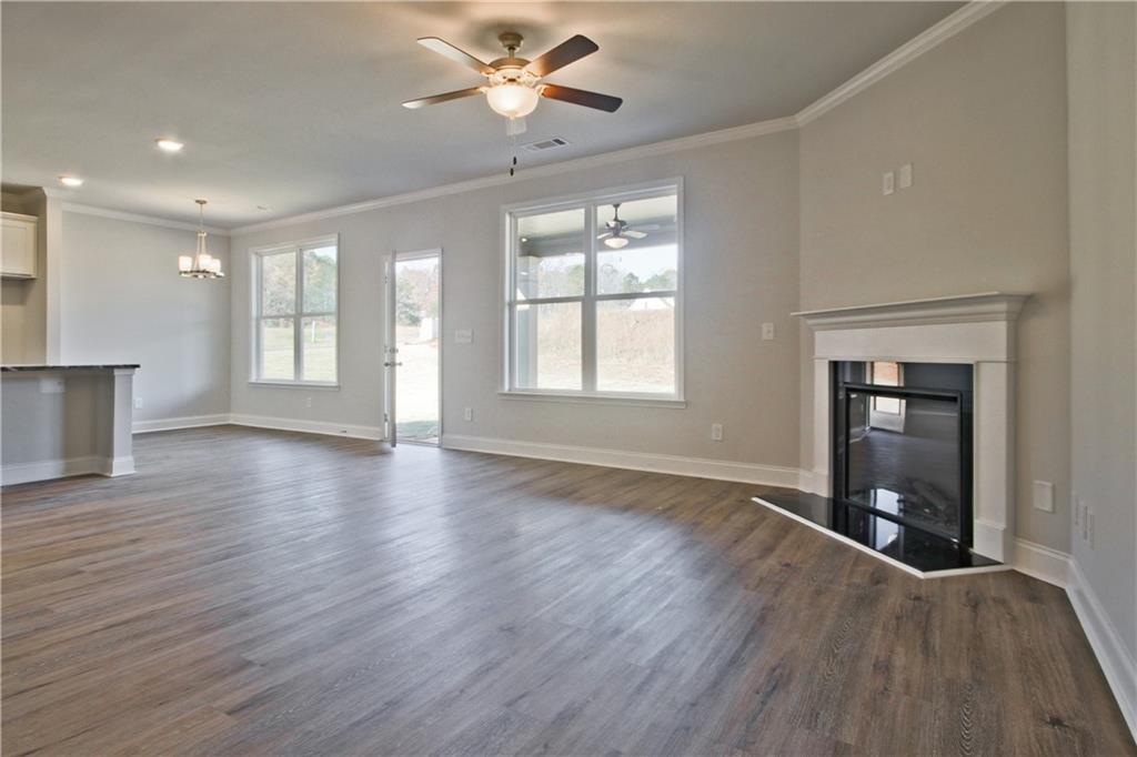 5984 Spring Way Lithonia, GA 30058 - Photo 8 of 37 wooden floor in an empty room with a window