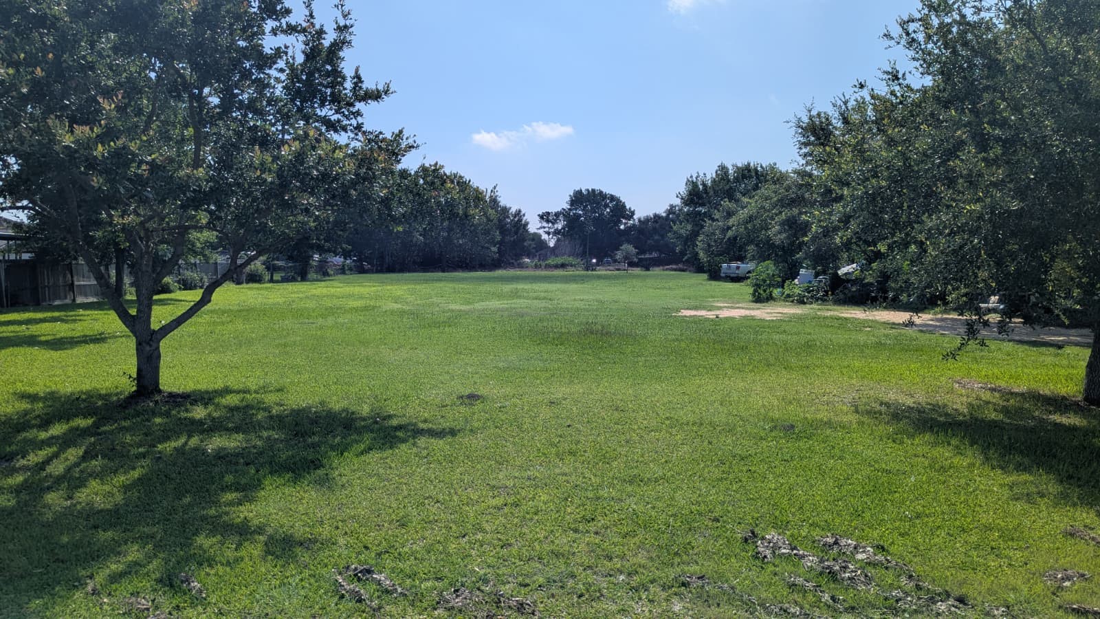 13929 Quention Drive Houston, TX 77045 - Photo 3 of 4 a view of field with trees in the background