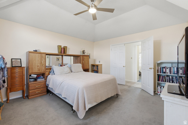 5788 Walden Ridge Drive Murray, UT 84123 - Photo 16 of 29 Vaulted ceiling bedroom featuring carpeting, a ceiling fan, light-toned wall paint, and white paneled doors