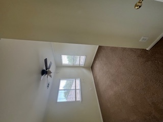14909 Nuttall Drive Austin, TX 78724 - Photo 10 of 13 Spare room with dark carpet and ceiling fan