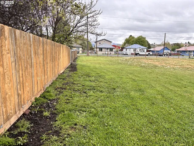 a view of a swimming pool with lawn chairs
