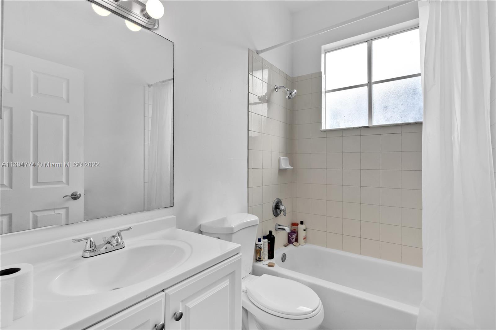 172 Southwest 15th Road Homestead, FL 33030 - Photo 9 of 23 a bathroom with a sink a toilet and shower