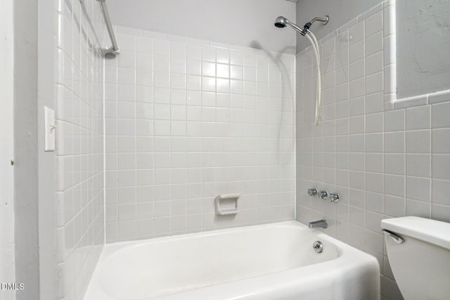 a view of a door and wooden floor