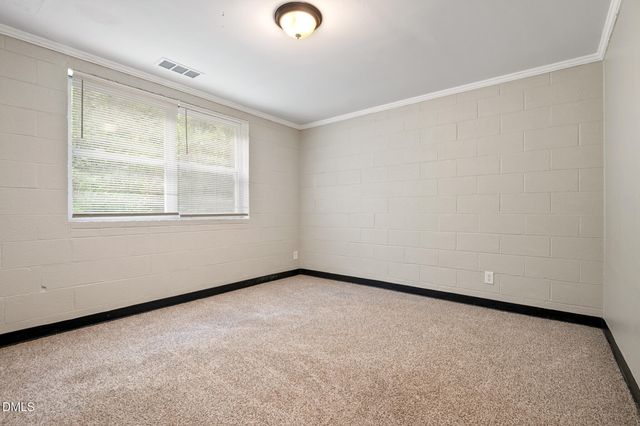 a kitchen with a sink a stove and cabinets