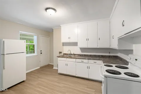 a bathroom with a sink mirror and window