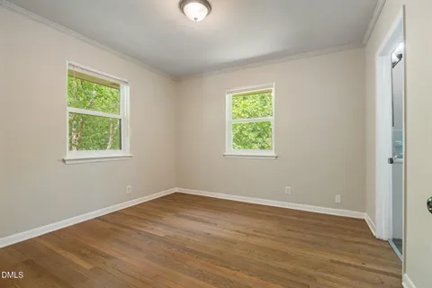 a bathroom with a sink a mirror and vanity