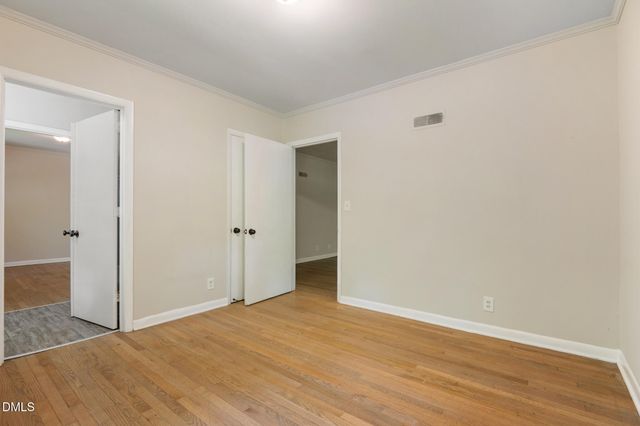a view of a porch with wooden floor and outside view