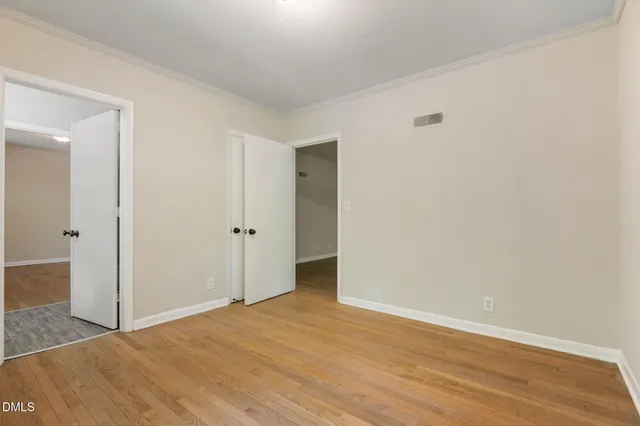 a view of a porch with wooden floor and outside view