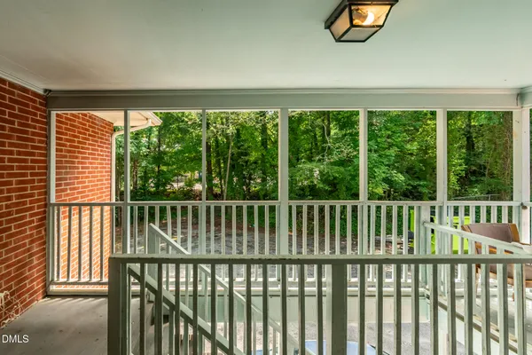 a white refrigerator freezer and cabinets