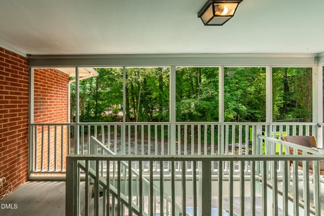 a white refrigerator freezer and cabinets