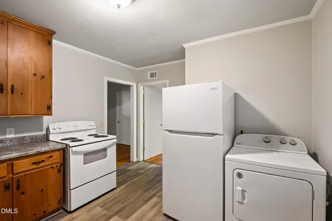 a view of a room that has a bed in it