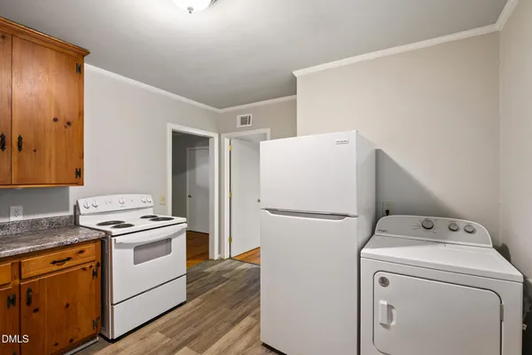 a view of a room that has a bed in it