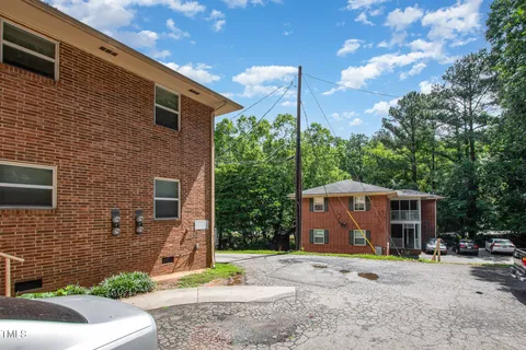a kitchen with a refrigerator and a stove top oven