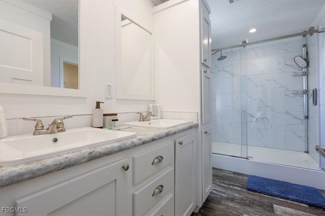 2801 York Road St. James City, FL 33956 - Photo 16 of 31 a bathroom with a granite countertop sink mirror and double
