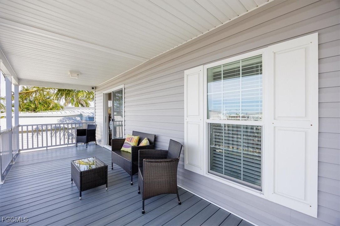 2801 York Road St. James City, FL 33956 - Photo 22 of 31 a living room with furniture and a wooden floor