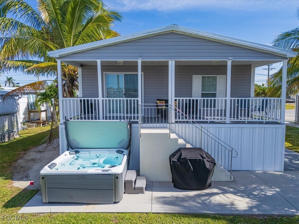 2801 York Road St. James City, FL 33956 - Photo 24 of 31 a view of house with backyard outdoor seating and entertaining space