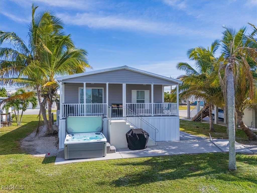 2801 York Road St. James City, FL 33956 - Photo 25 of 31 a front view of a house with garden