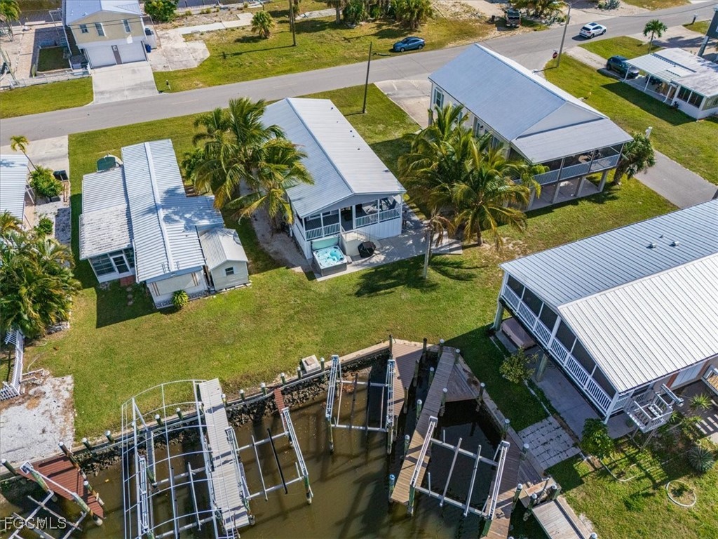 2801 York Road St. James City, FL 33956 - Photo 27 of 31 an aerial view of multiple houses with yard