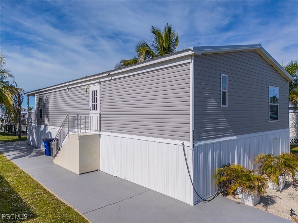 2801 York Road St. James City, FL 33956 - Photo 4 of 31 a view of a house with a patio