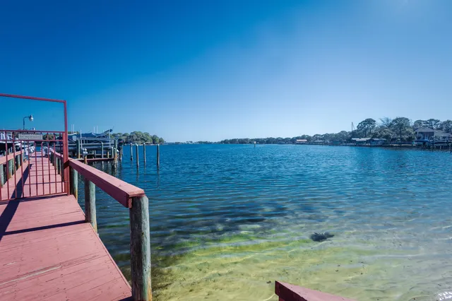 a view of swimming pool with outdoor seating and yard in back