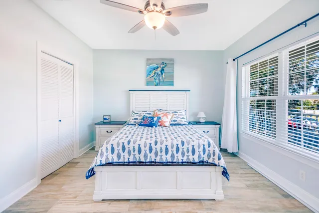 a bedroom with a bed and window