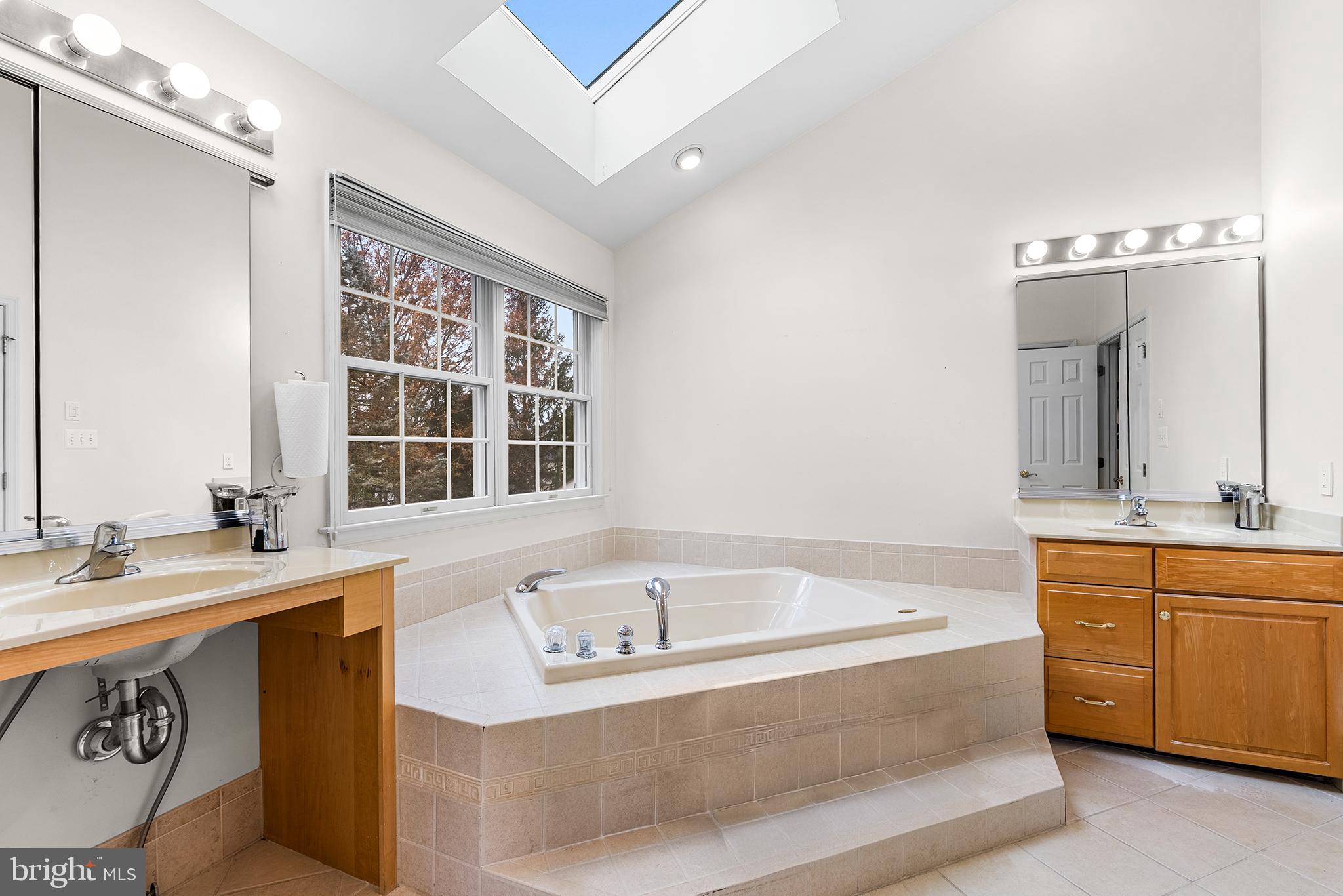 2000 St Andrews Drive Berwyn, PA 19312 - Photo 24 of 44 a bathroom with a tub sink and mirror