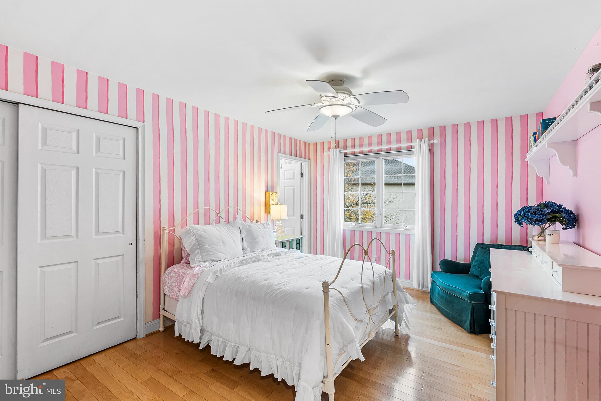 2000 St Andrews Drive Berwyn, PA 19312 - Photo 25 of 44 a bedroom with a bed and a chandelier