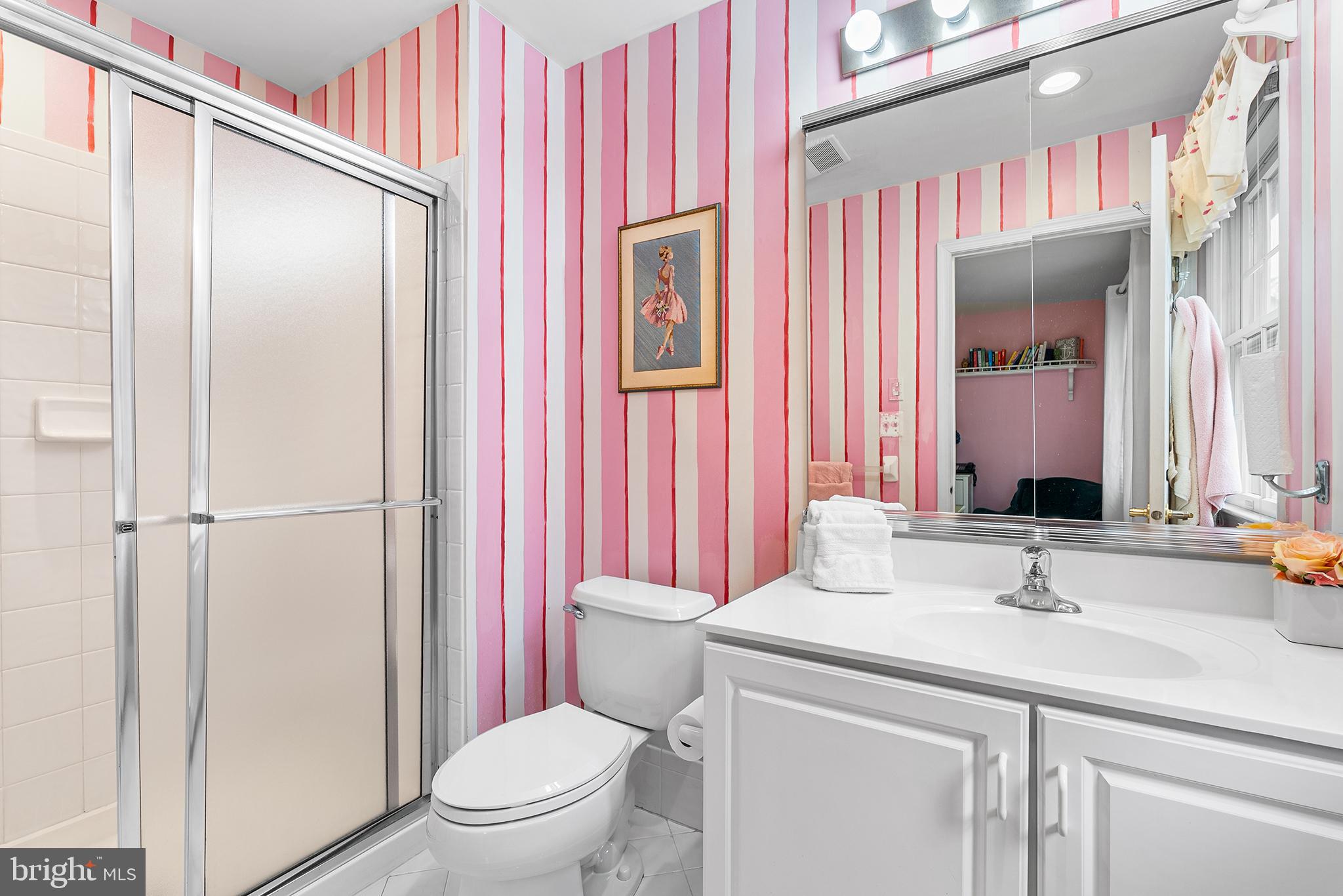 2000 St Andrews Drive Berwyn, PA 19312 - Photo 26 of 44 a bathroom with a sink a toilet a mirror and shower curtain