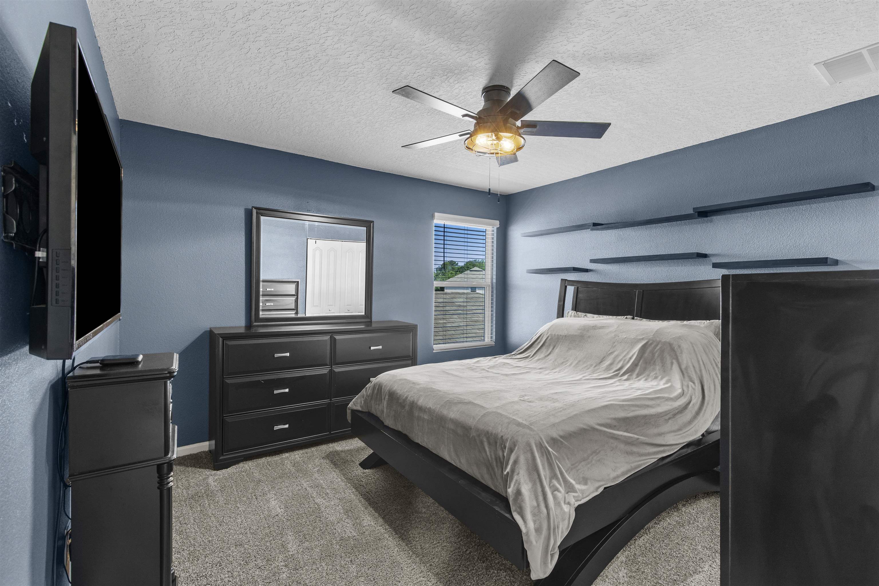 266 Caminha Road St. Augustine, FL 32084 - Photo 29 of 59 a bedroom with a bed and a flat screen tv