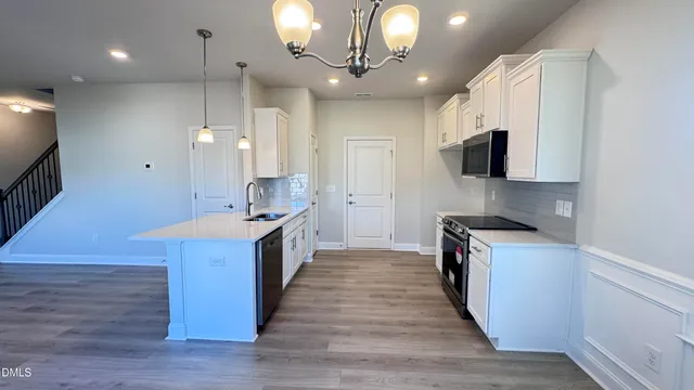 a view of an empty room with closet