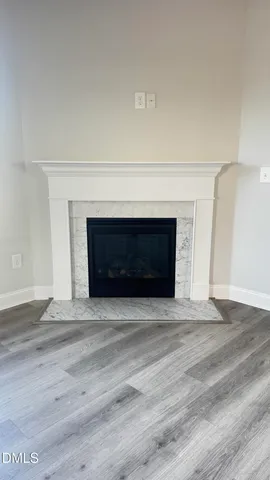 a view of a kitchen and a sink window wooden floor