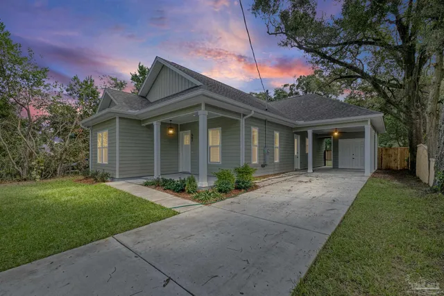 a front view of a house with garden