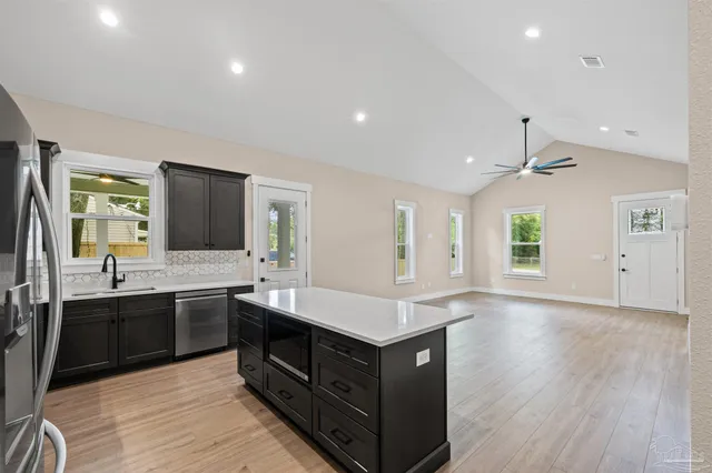 a kitchen with a stove and a sink