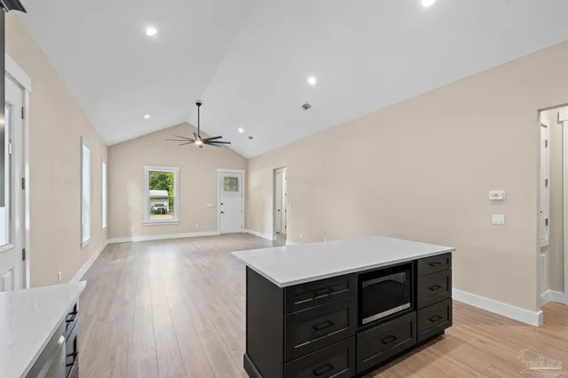 a view of cabinets and wooden floor