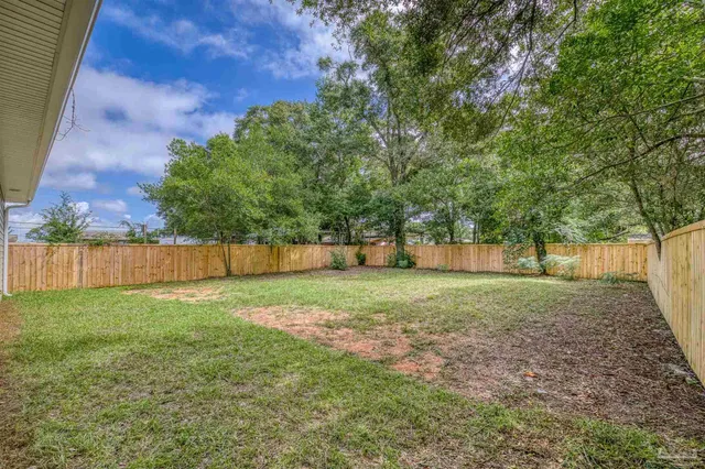 a backyard of a house with lots of green space