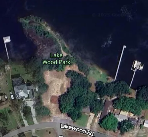 an aerial view of a house outdoor space and street view