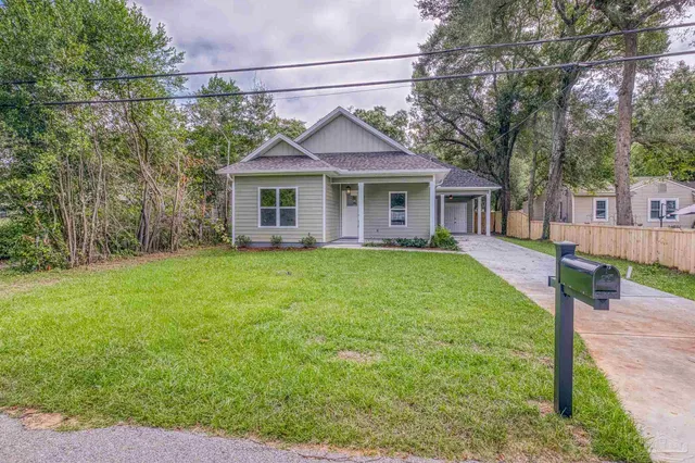 a view of a house with a yard