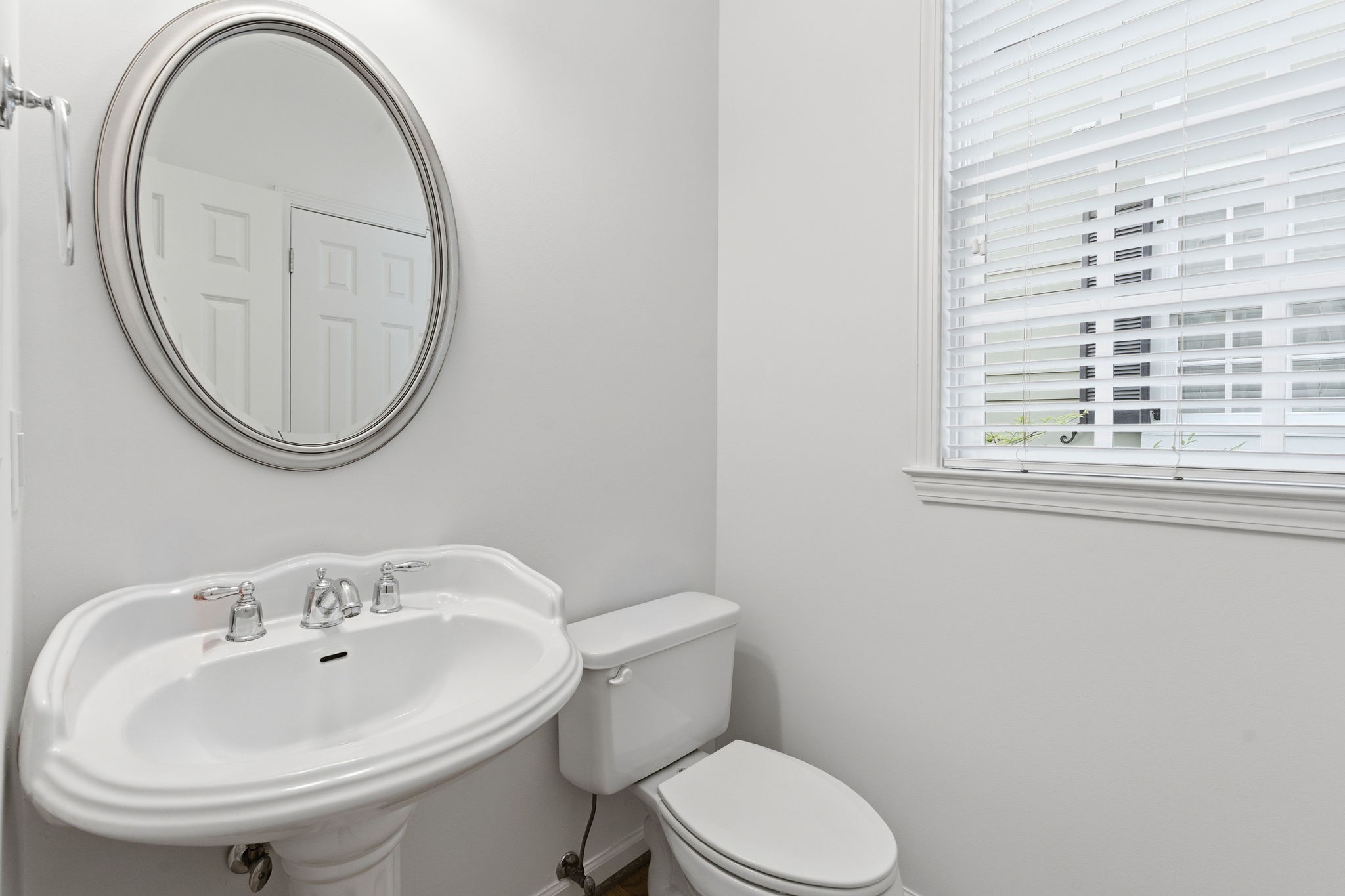 206 Pearl Street Franklin, TN 37064 - Photo 16 of 38 a white toilet sitting next to a bathroom sink