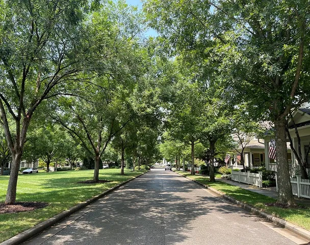 a view of a porch with furniture and a yard