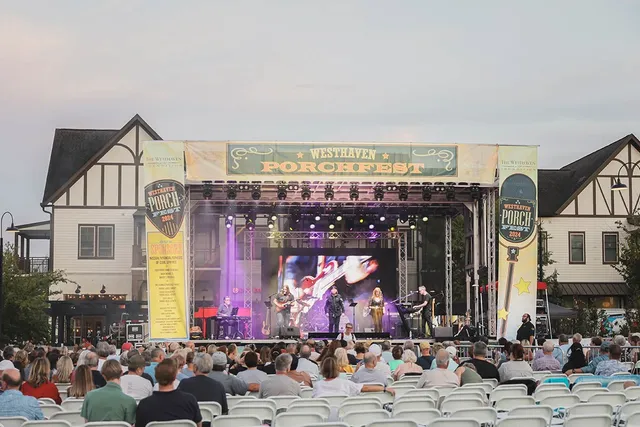 a view of a livingroom with a fireplace and window