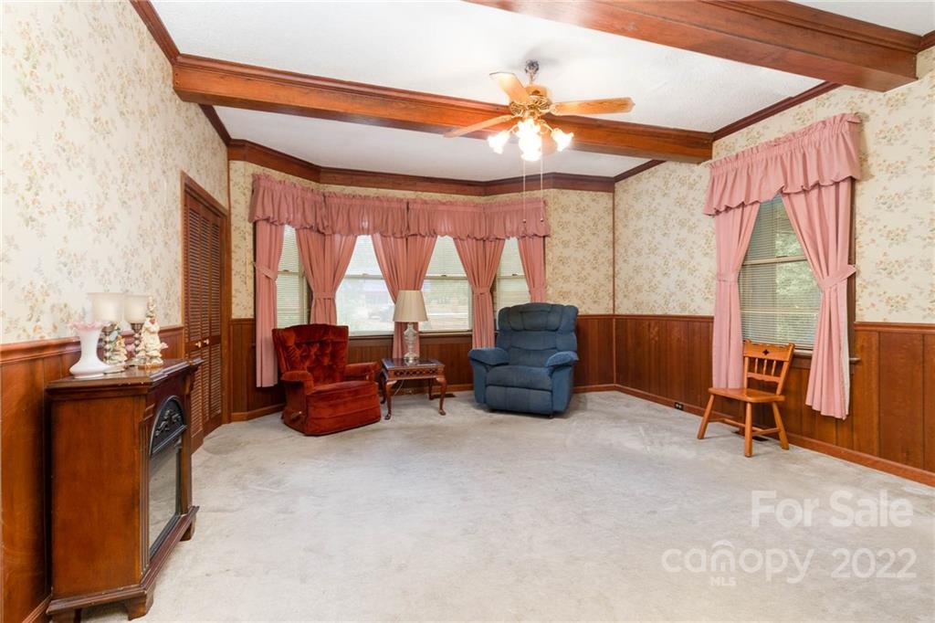 8209 Moores Chapel Road Charlotte, NC 28214 - Photo 11 of 32 a room with furniture and a window